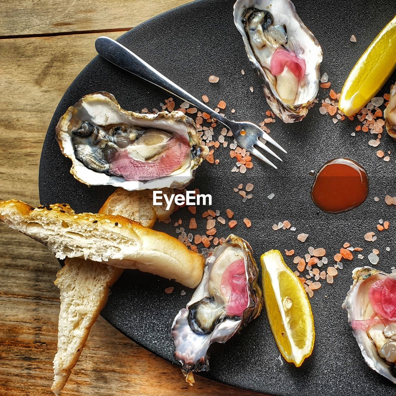 High angle view of oysters on serving dish on  table