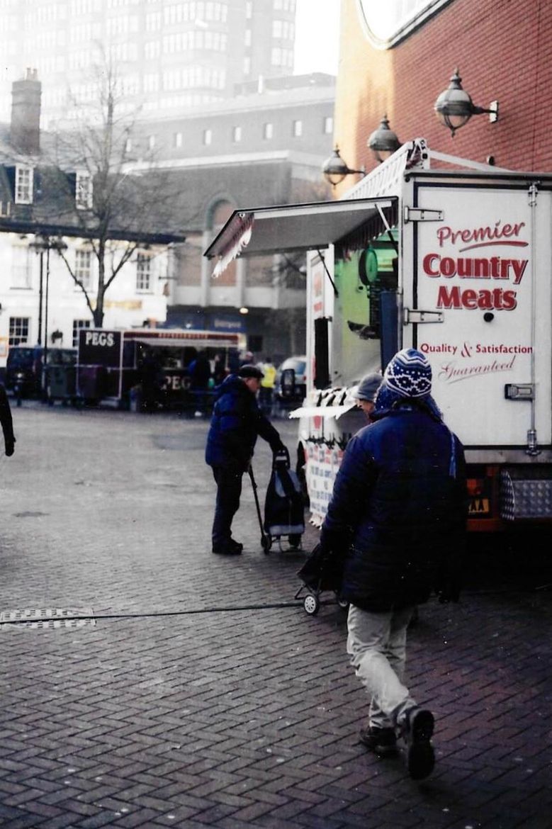 WOMAN WALKING ON CITY STREET