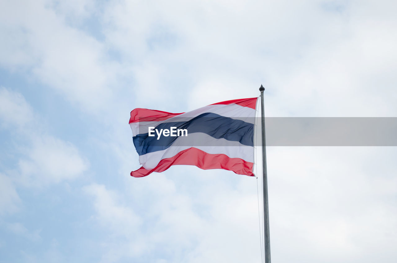 Low angle view of fluttering flag