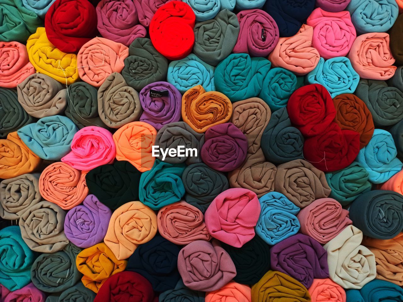 Colorful piles of headscarves that are neatly arranged when sold in markets, medan, indonesia