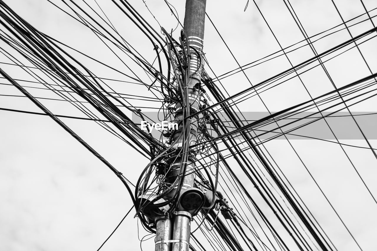Low angle view of cables against clear sky