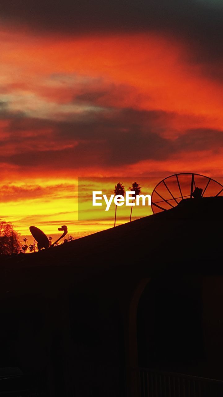 SILHOUETTE HORSE ON ORANGE SUNSET AGAINST SKY