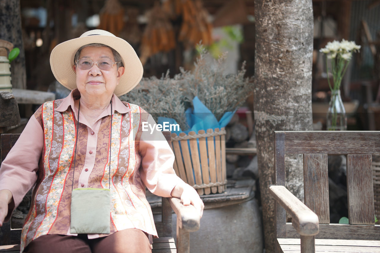 Asian old elder woman elderly female relaxing resting on terrace at home. senior leisure lifestyle