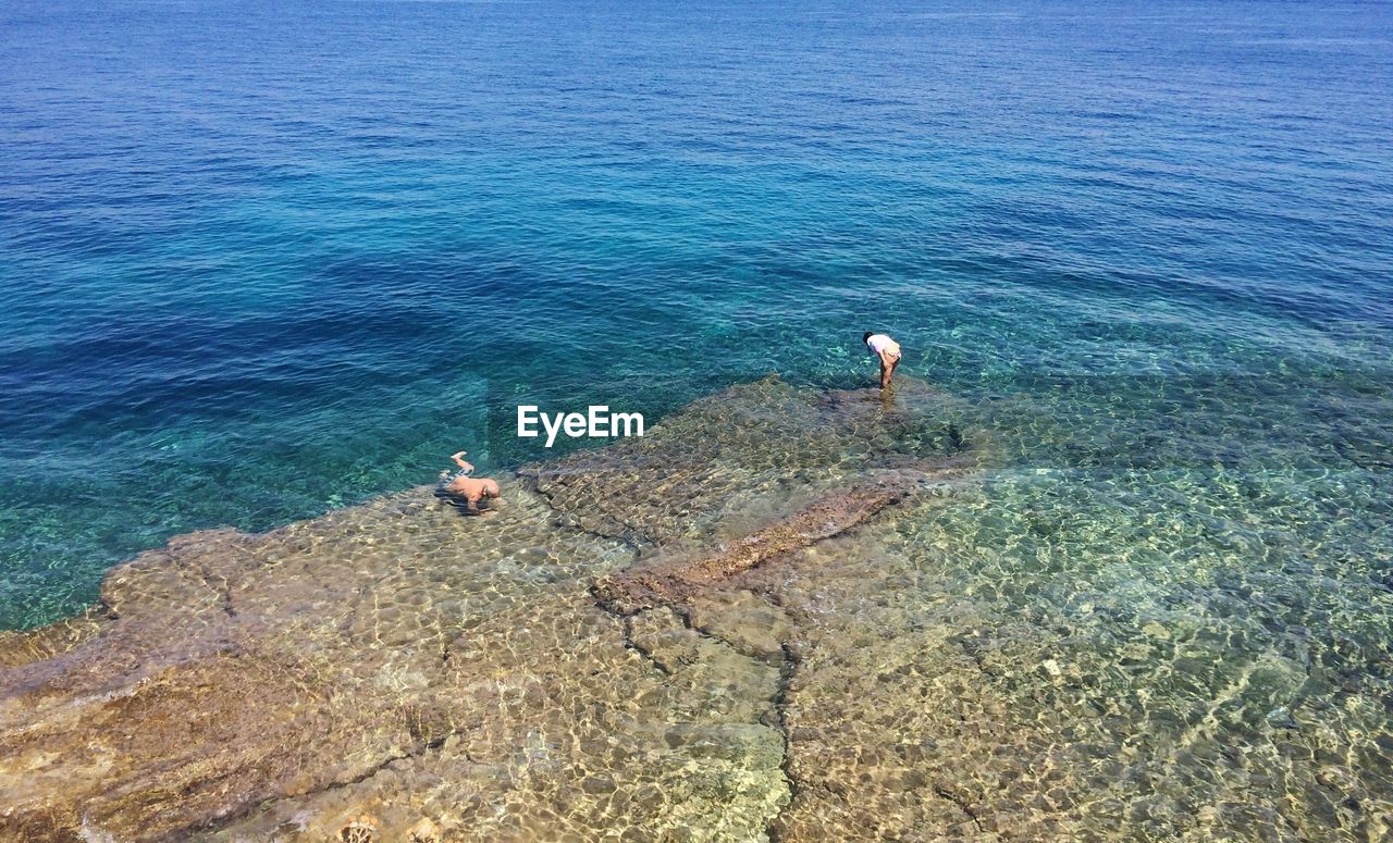 High angle view of people at sea shore