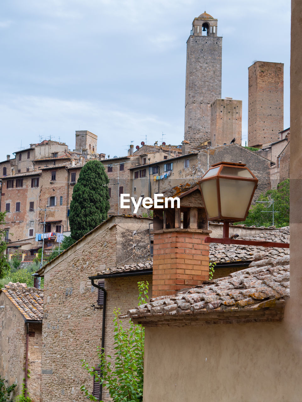 Details of bell towers and brick houses in san gimignano in tuscany, siena - italy.