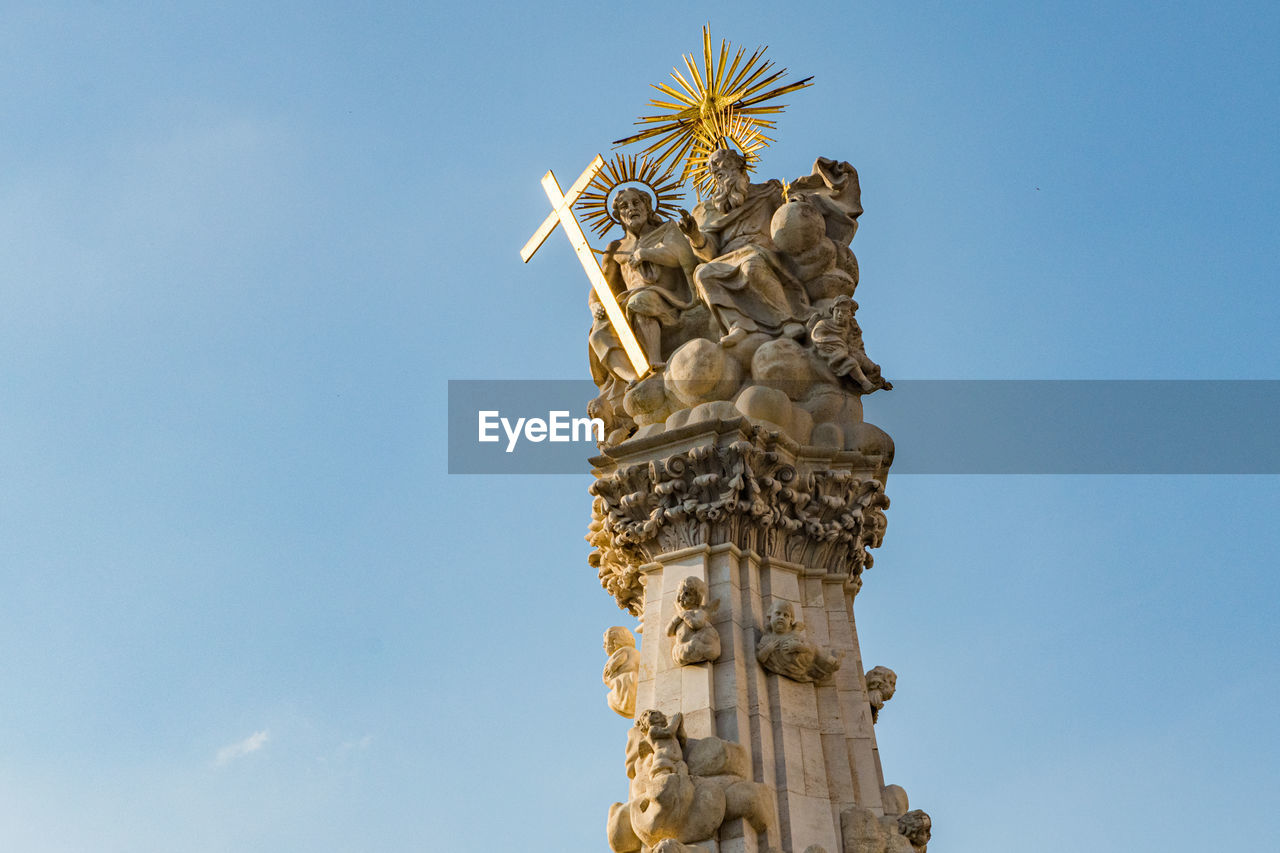 sky, sculpture, nature, architecture, statue, blue, travel destinations, no people, landmark, history, low angle view, monument, the past, day, craft, travel, outdoors, representation, clear sky, built structure, human representation, temple, religion, city, sunny, plant, belief