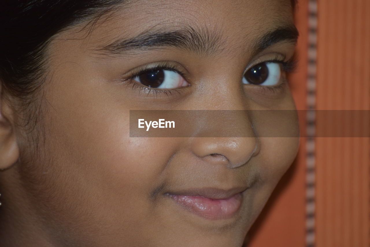 Close-up portrait of smiling girl