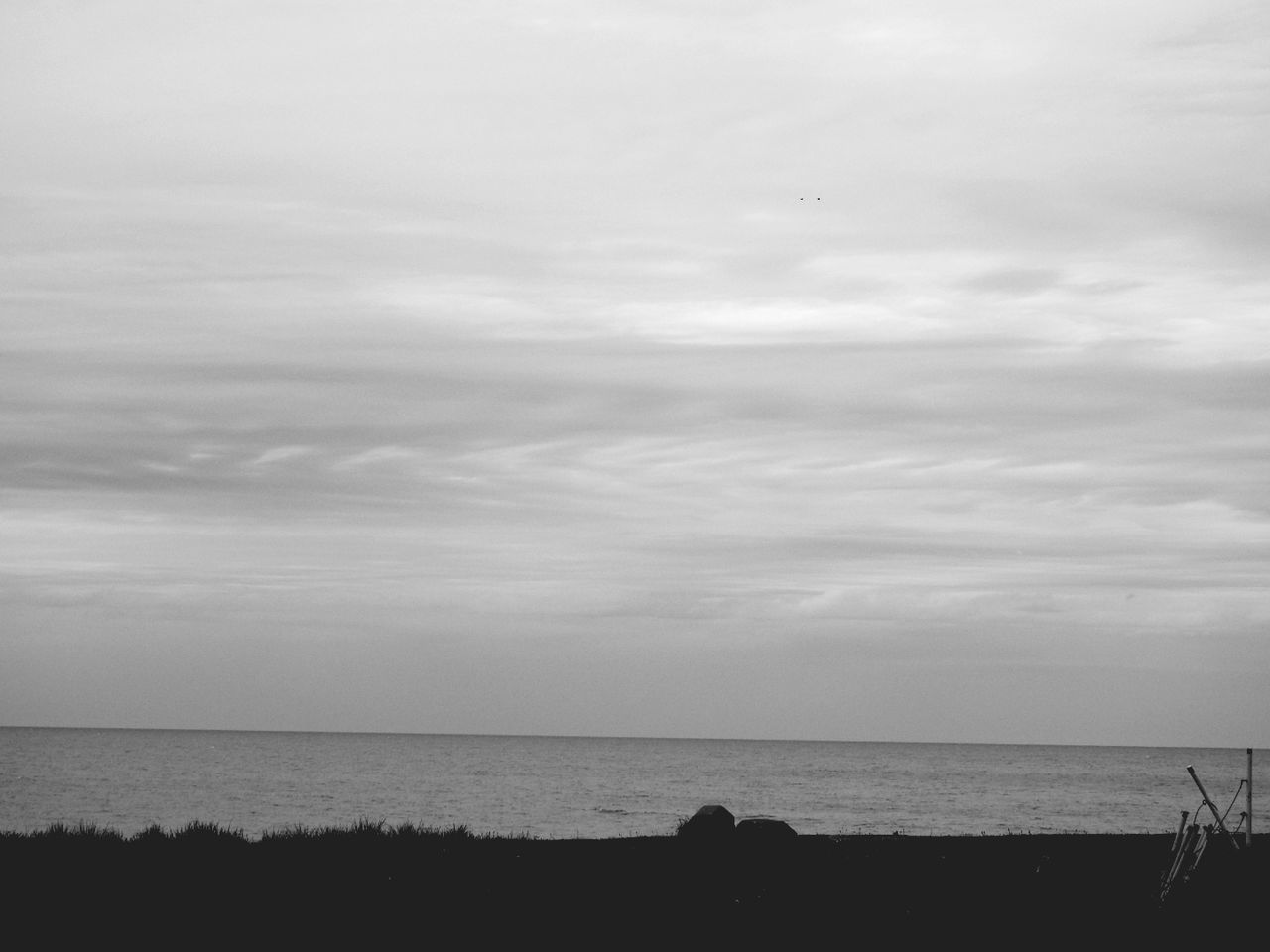 SILHOUETTE BEACH AGAINST SKY
