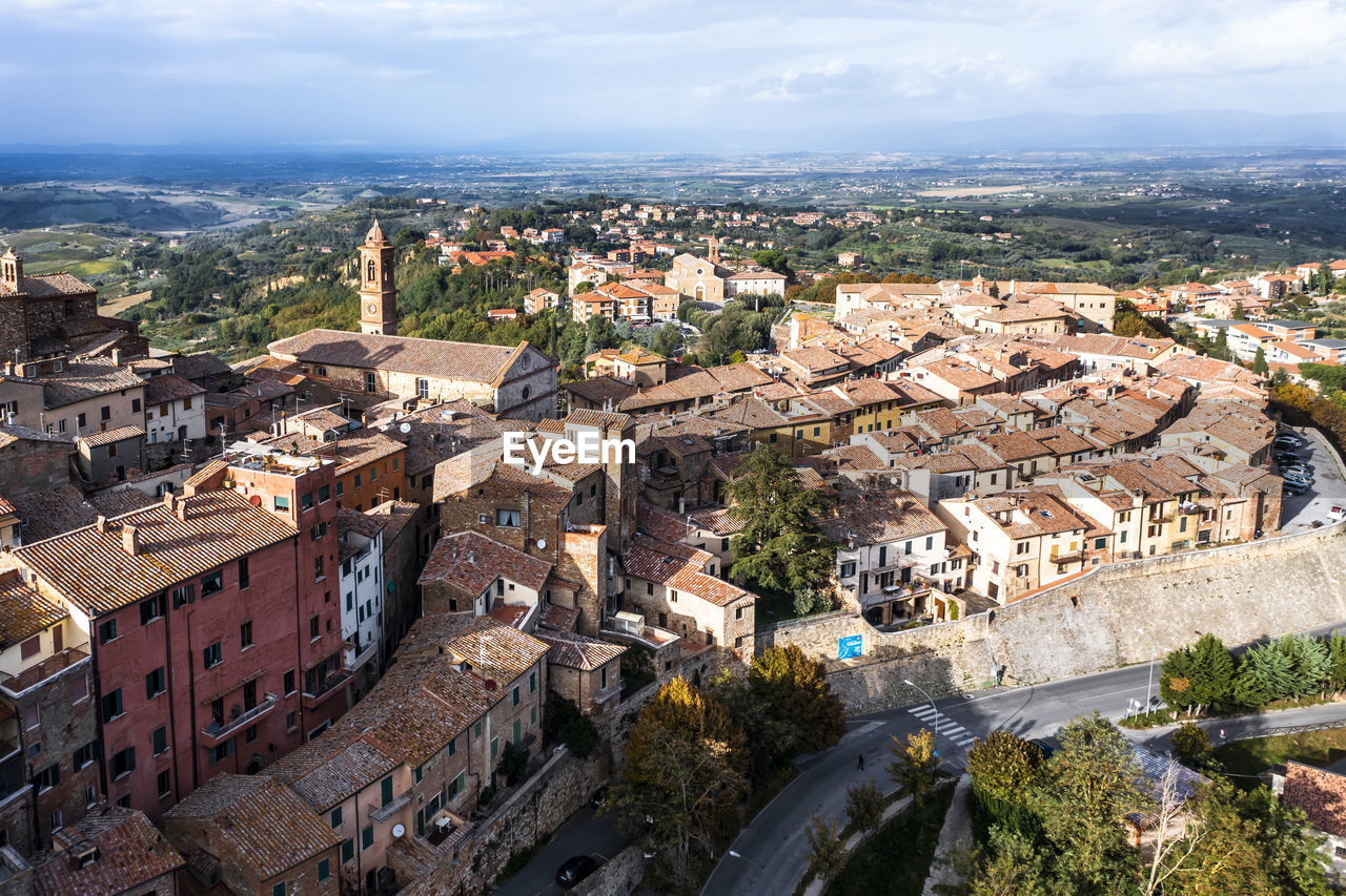 Italy, province of siena, montepulciano, helicopter view of medieval hill town in val dorcia