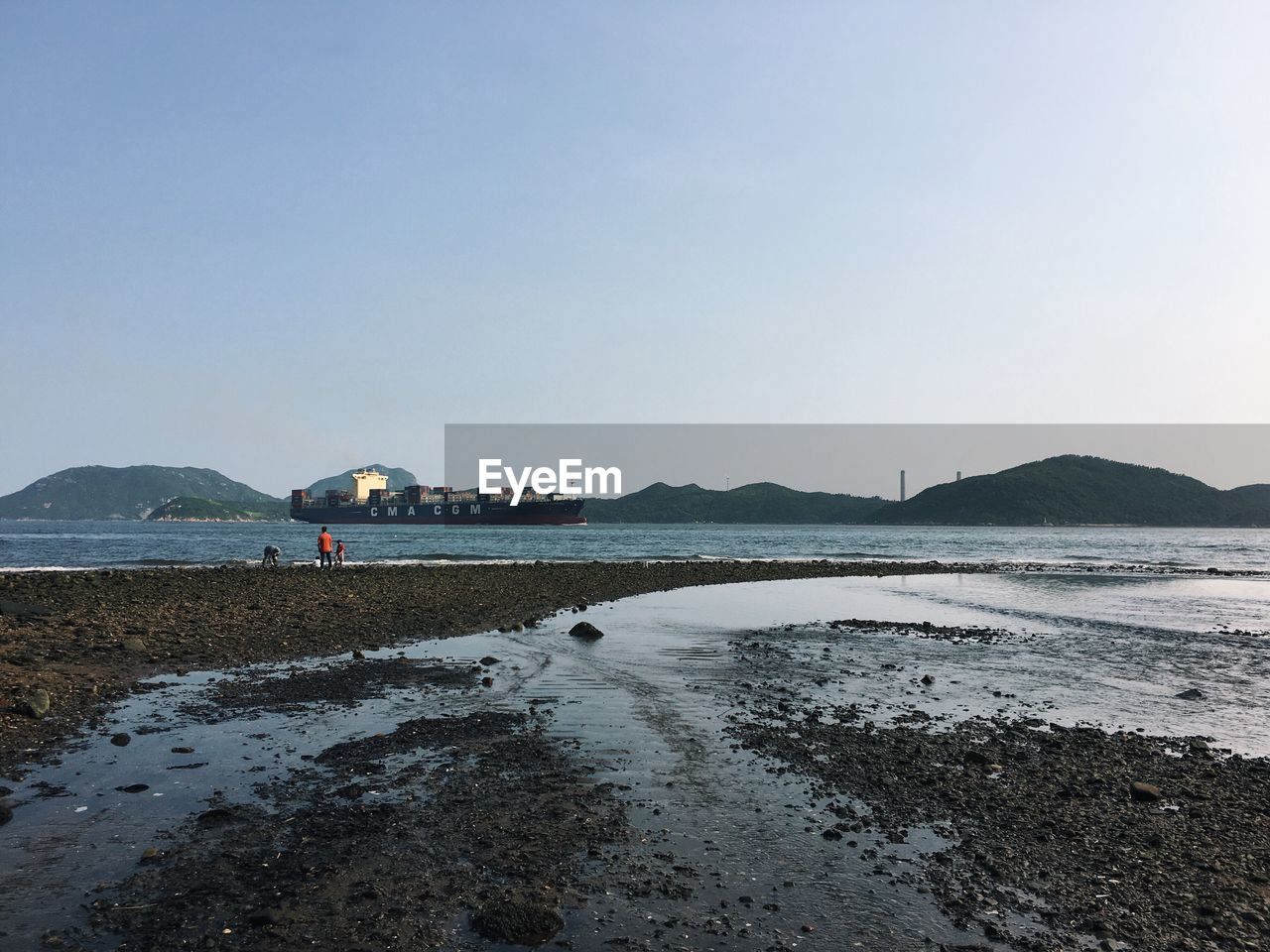 Scenic view of beach against clear sky