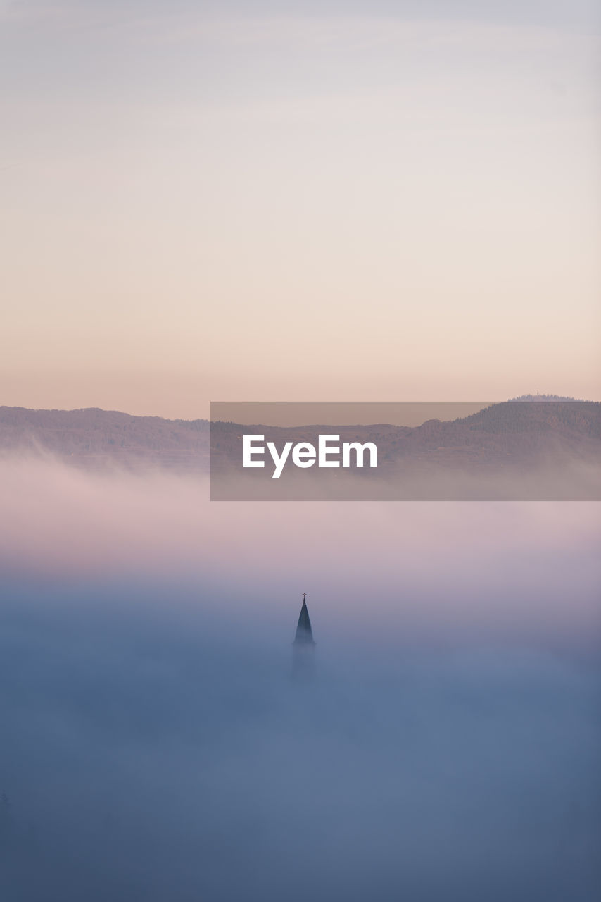 Scenic view of foggy sunrise