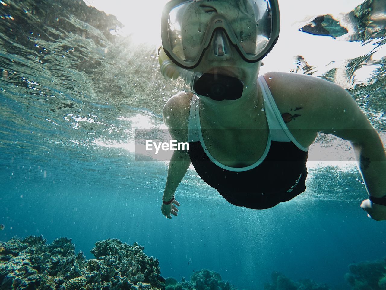 MAN SWIMMING UNDERWATER