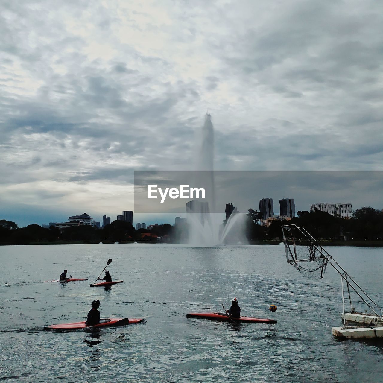 PEOPLE ENJOYING AT FOUNTAIN OF BUILDING