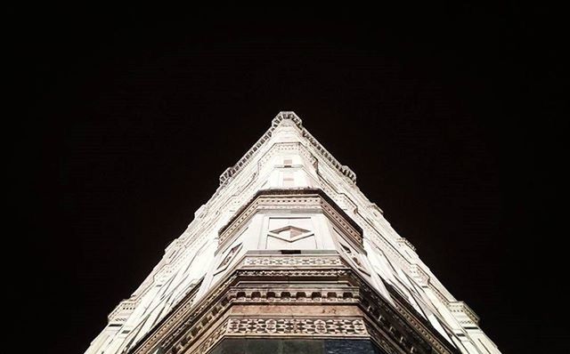 LOW ANGLE VIEW OF BUILT STRUCTURE AT NIGHT