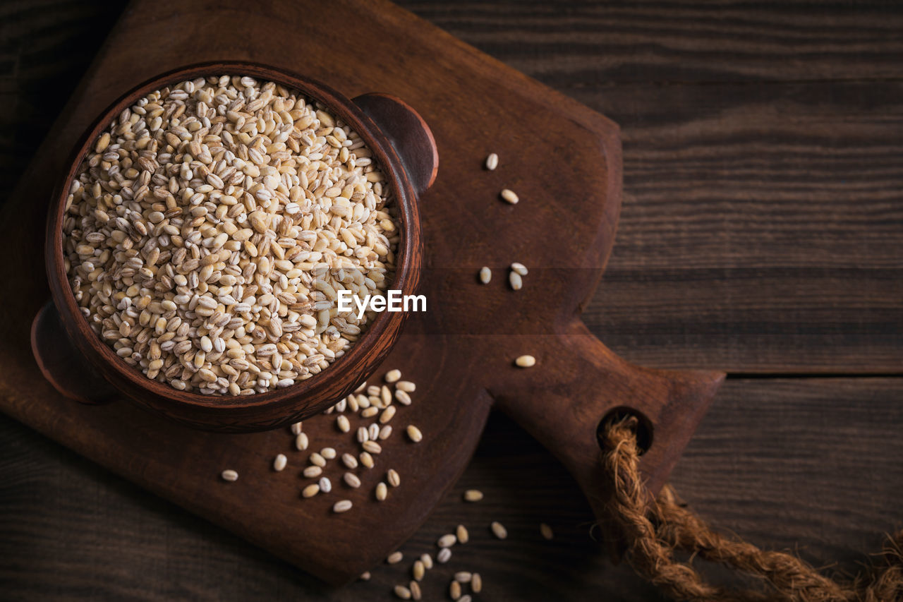 Organic uncooked dried barley cereal grain in a bowl