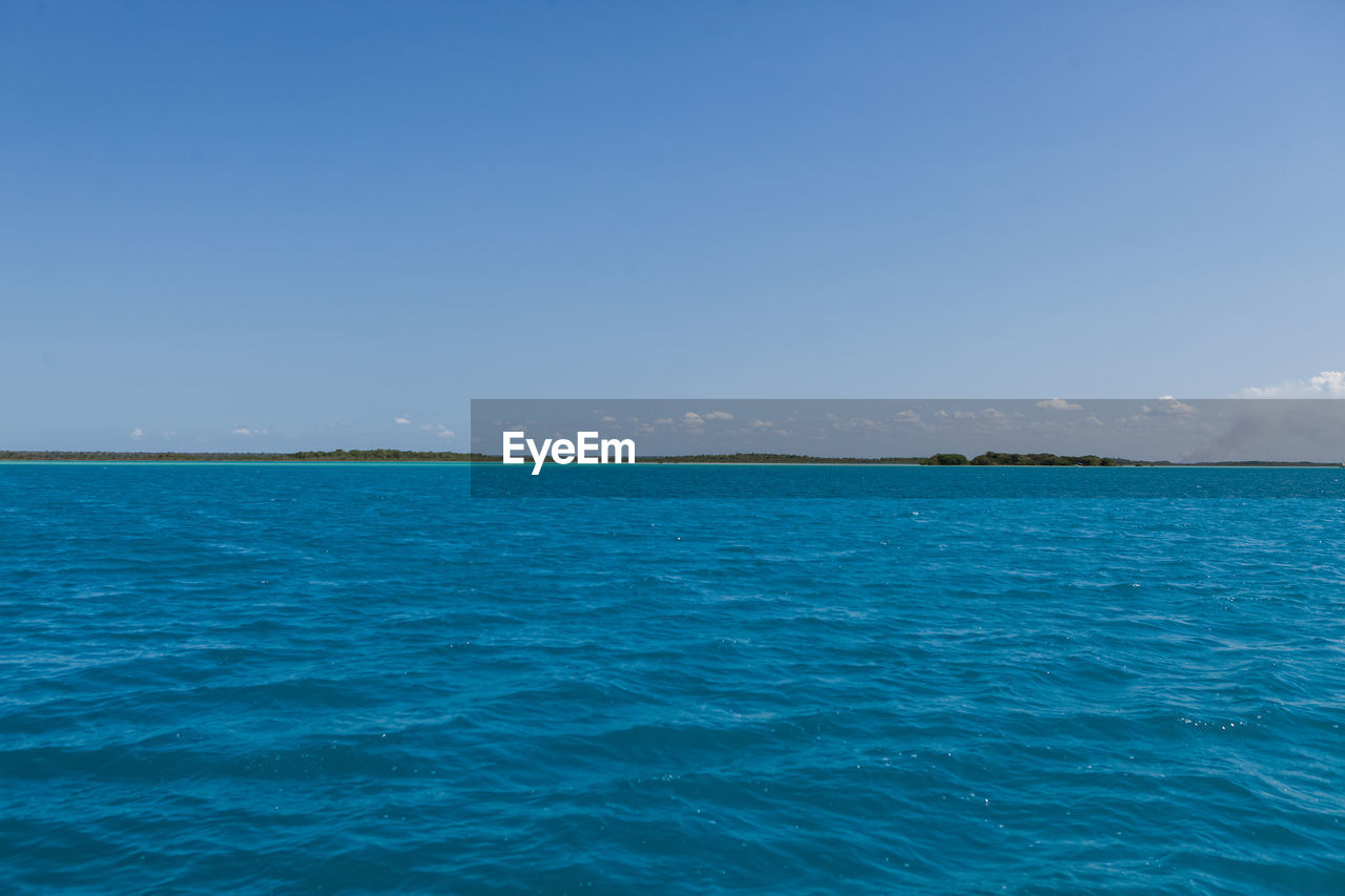 VIEW OF SEA AGAINST BLUE SKY