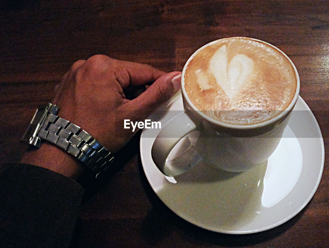 CLOSE-UP OF COFFEE CUP WITH COFFEE CUP