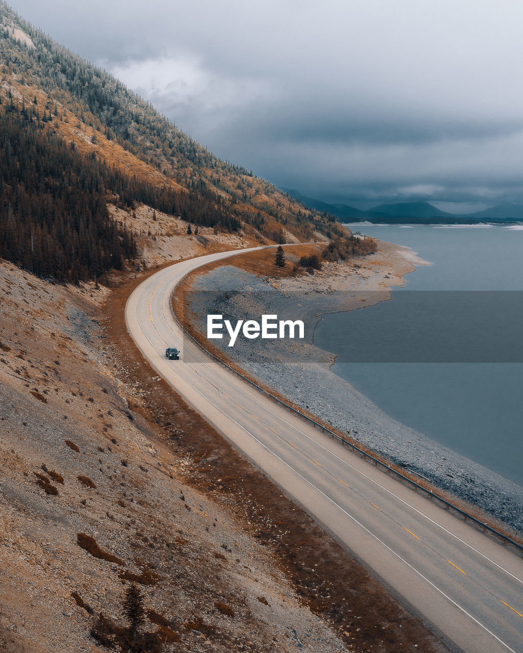 A truck driving through a scenic road in alberta