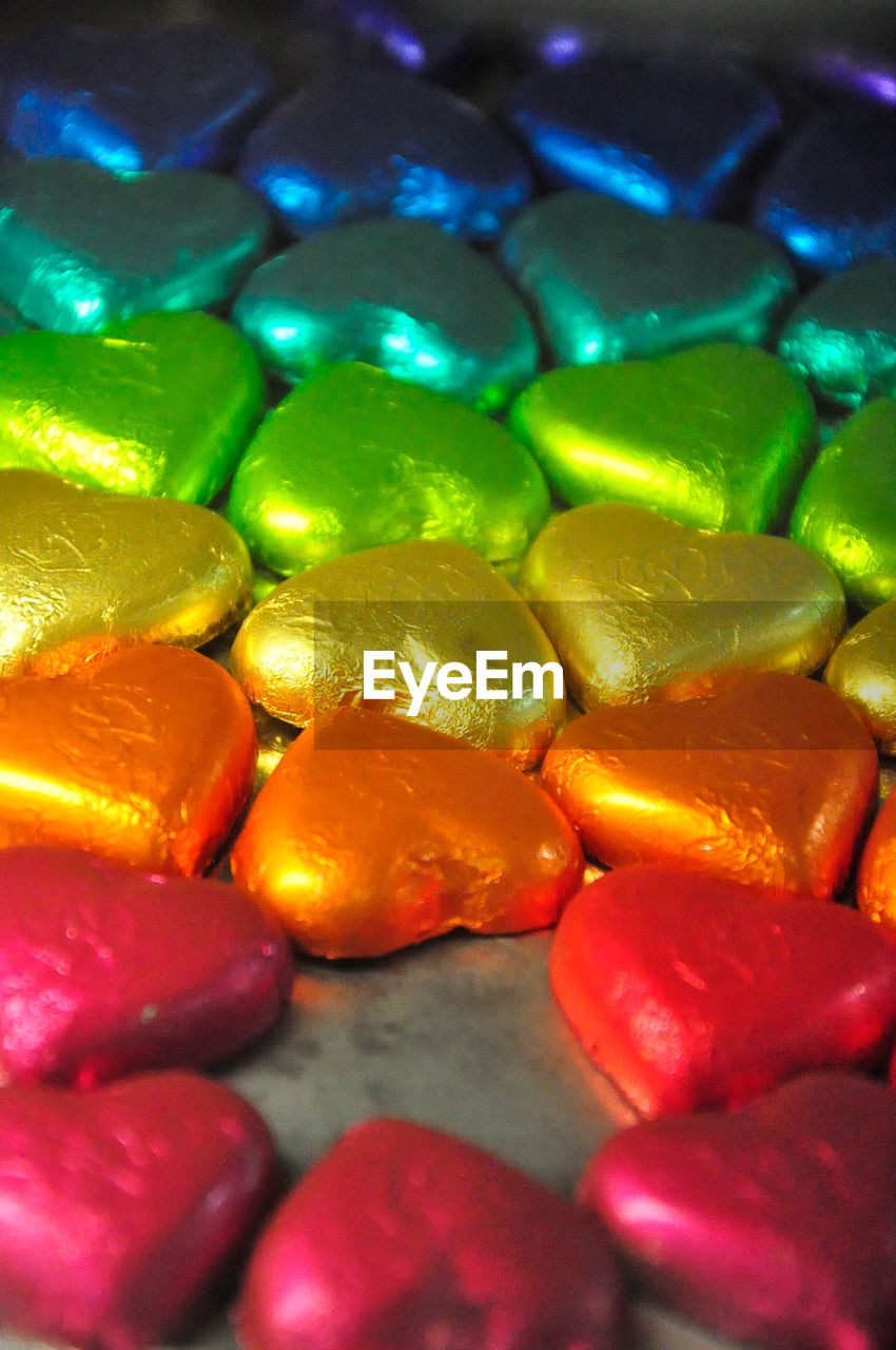 Close-up of multi colored heart shape desserts