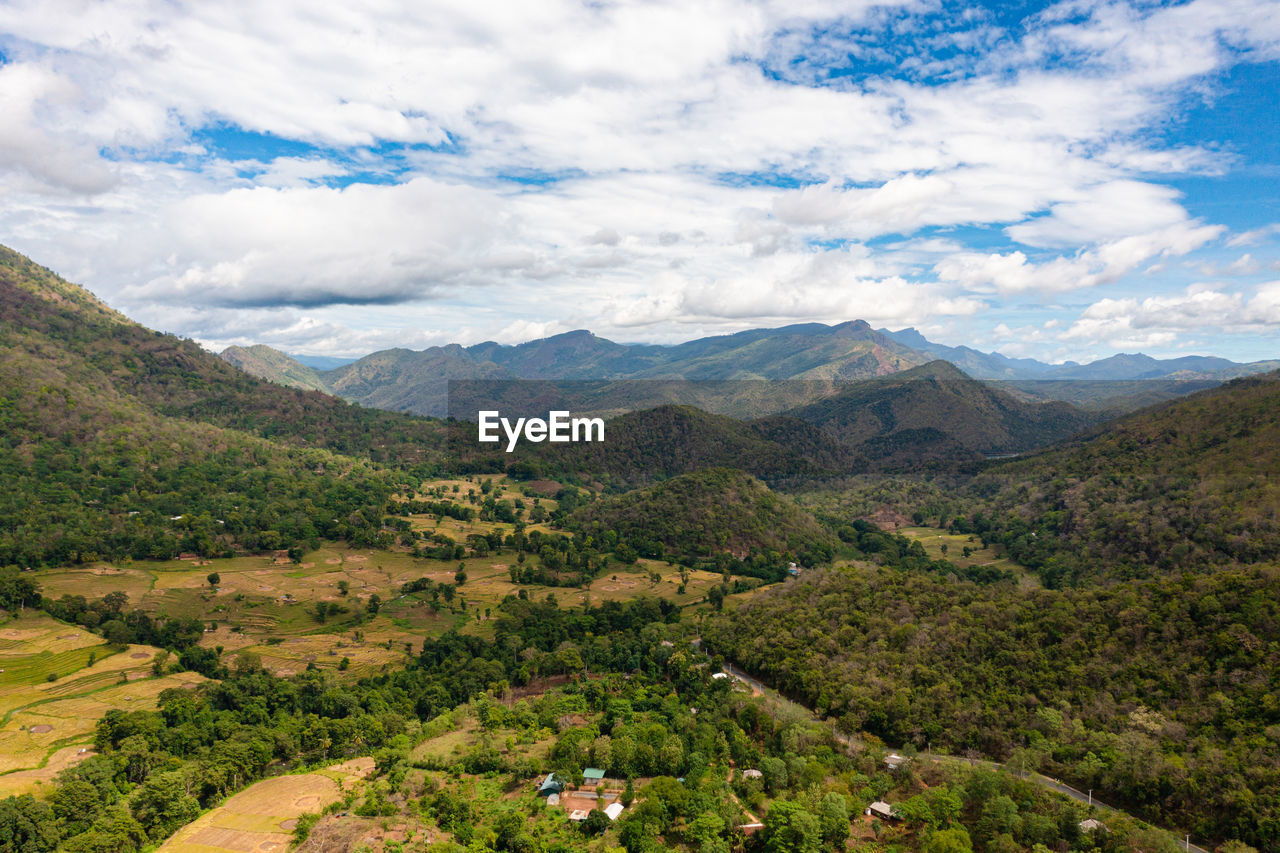Aerial drone of rice fields and terraces in a valley among the mountains. 