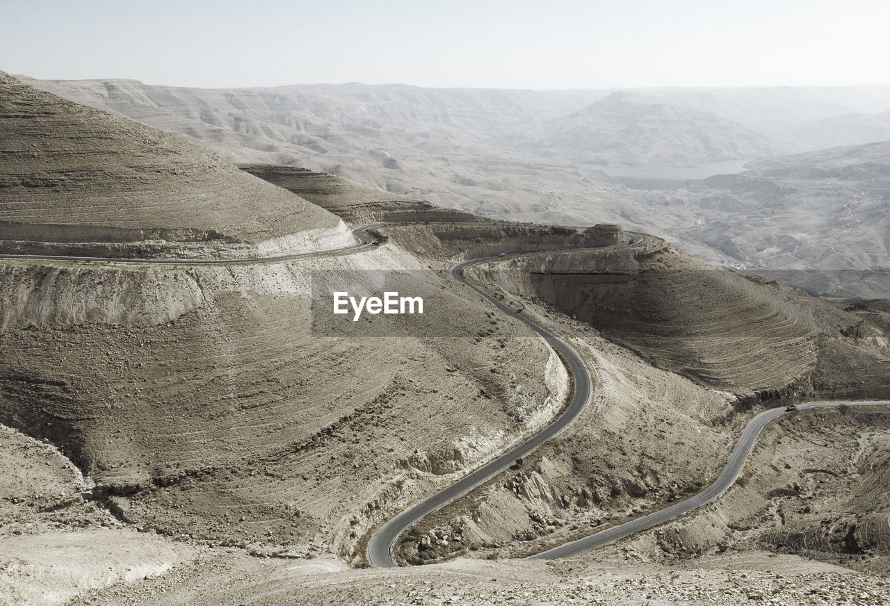 High angle view of winding road on land