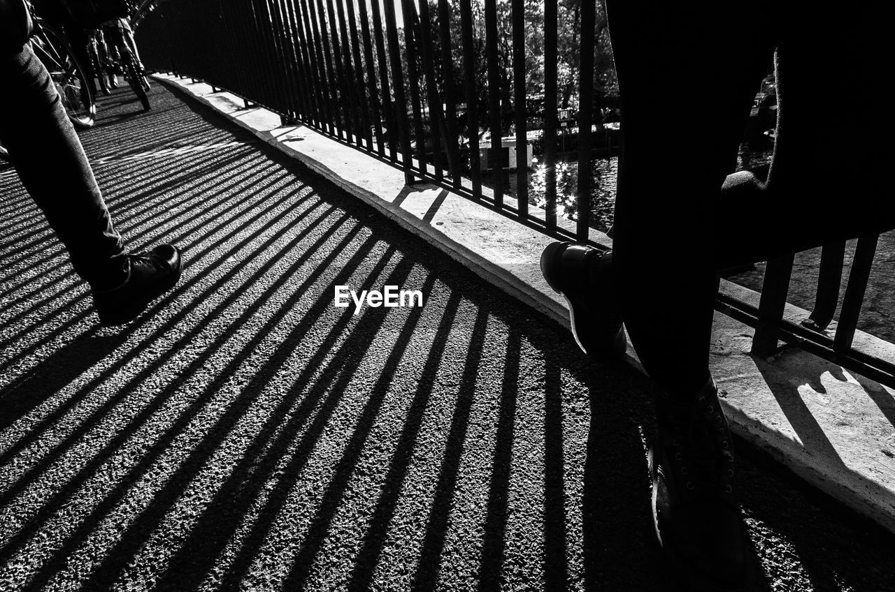 LOW SECTION OF MAN ON RAILING