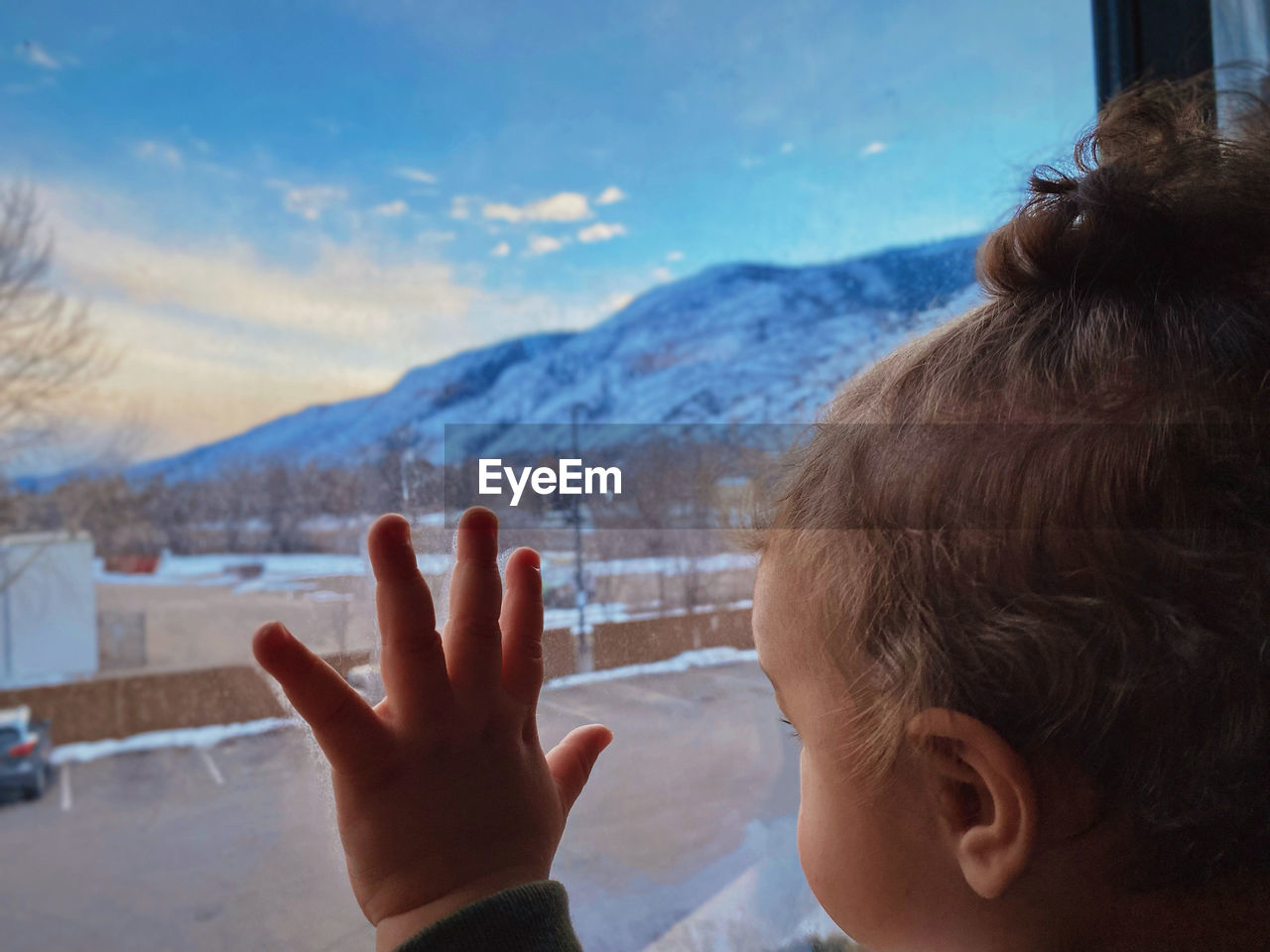 snow, mountain, one person, child, childhood, headshot, portrait, hand, mountain range, nature, men, winter, cold temperature, vacation, sky, day, blue, leisure activity, person, cloud, looking, outdoors, focus on foreground, beauty in nature, finger, environment, gesturing, rear view, holiday, scenics - nature, close-up, lifestyles, fun