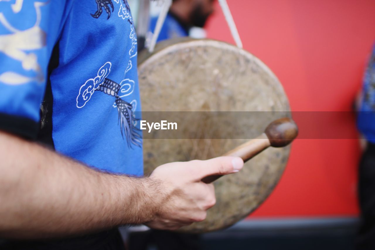 Close-up of man playing musical instrument