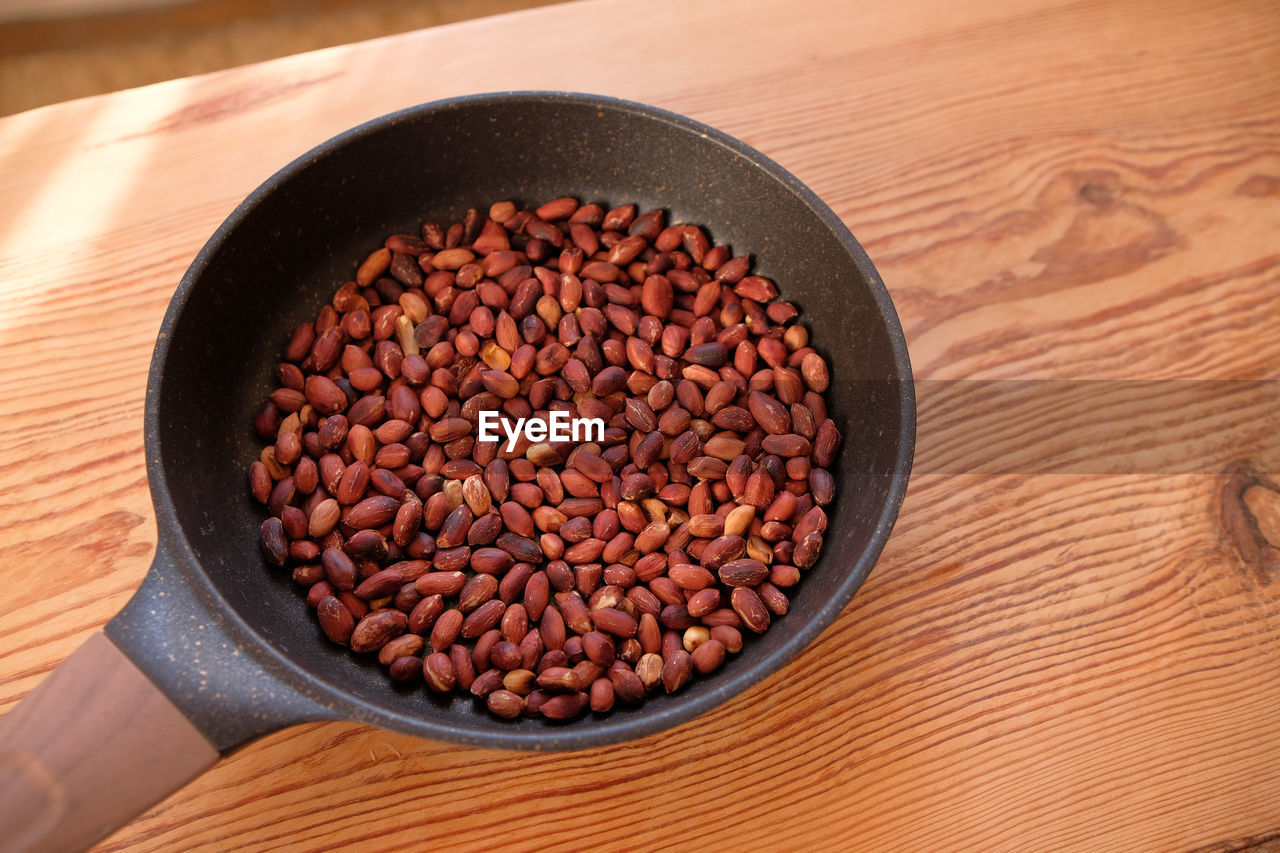 high angle view of green peas in bowl on table