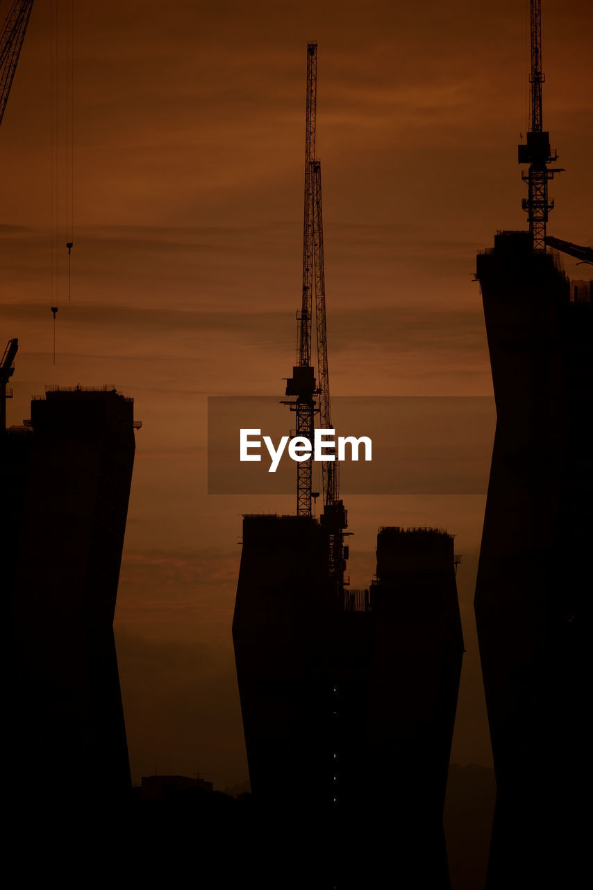 SILHOUETTE OF TOWER AGAINST SKY