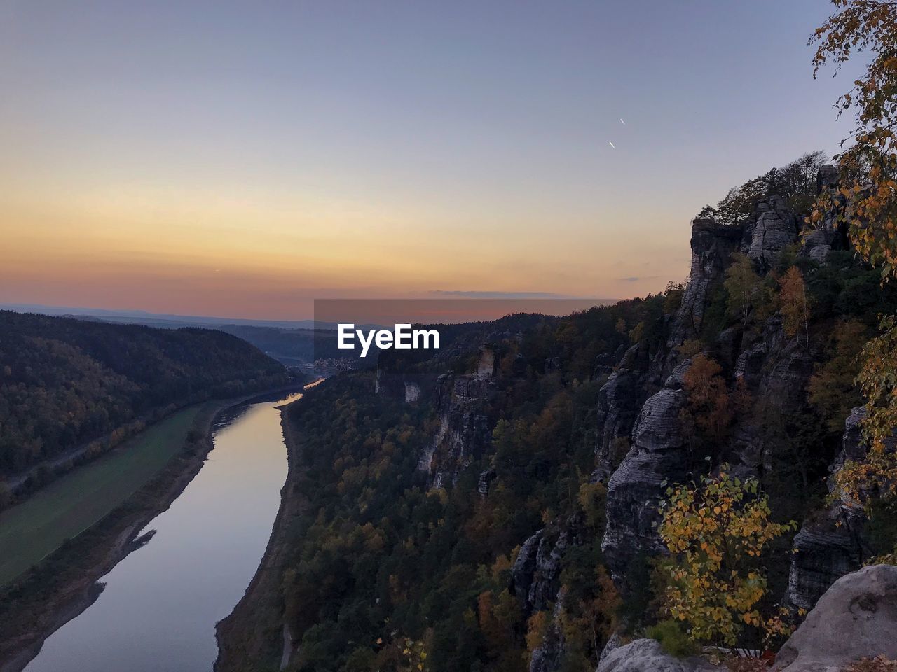 Scenic view of mountains against sky during sunset