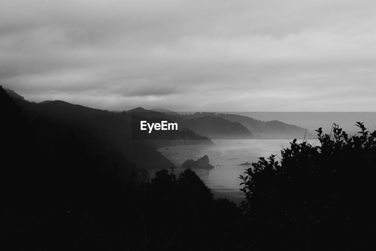 Scenic view of silhouette mountains against sky