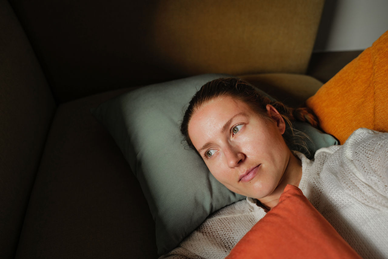 Woman relaxing on the colorful pillows