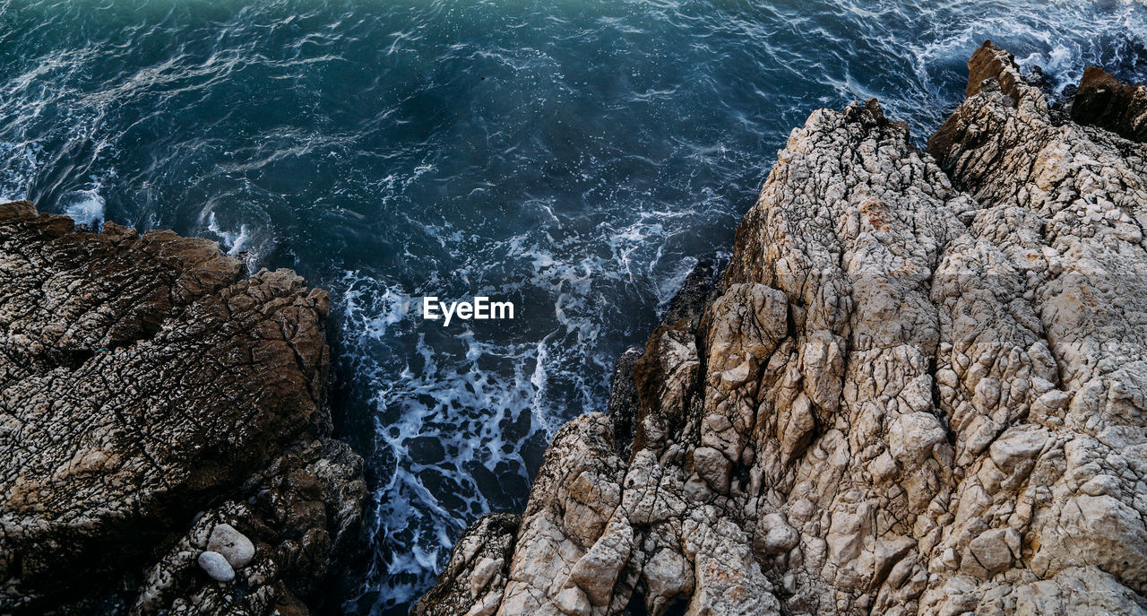 High angle view of rock formation at sea shore