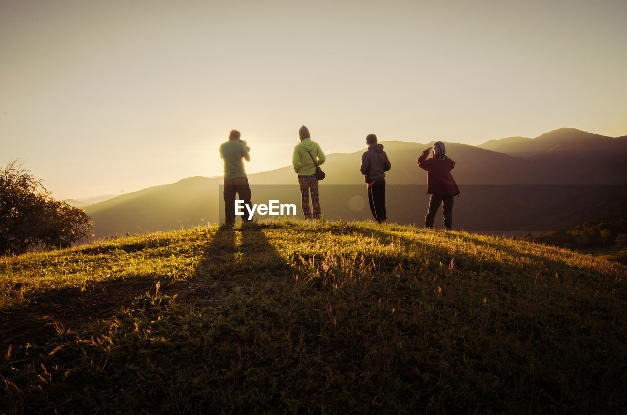 Rear view of people on mountain