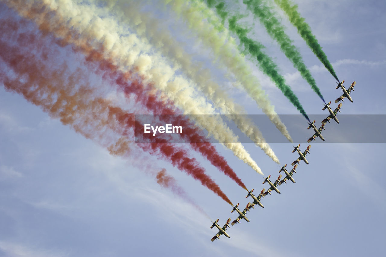 LOW ANGLE VIEW OF AIRPLANE FLYING IN SKY