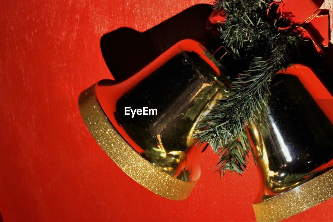 Close-up of christmas bells on red door