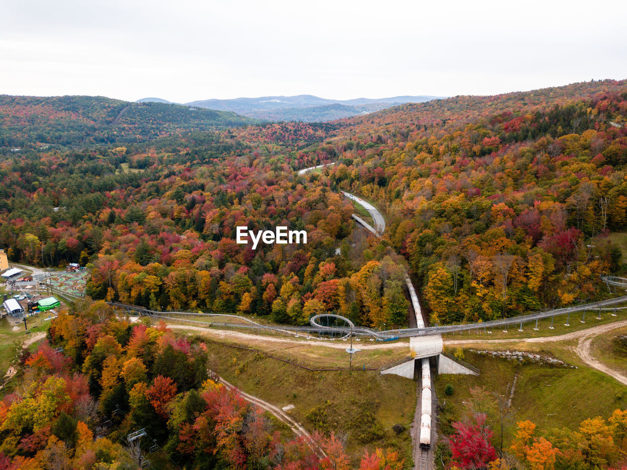 HIGH ANGLE VIEW OF TREES AND PLANTS AGAINST SKY DURING AUTUMN