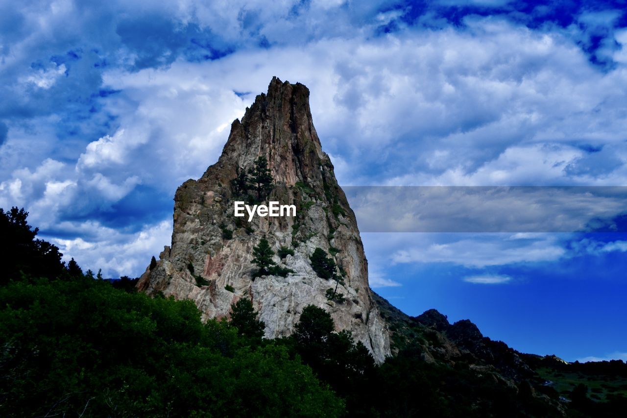 Low angle view of rocks against sky