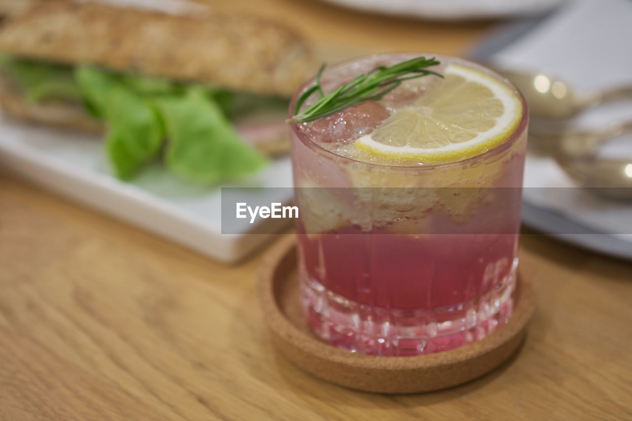 CLOSE-UP OF GLASS OF JUICE