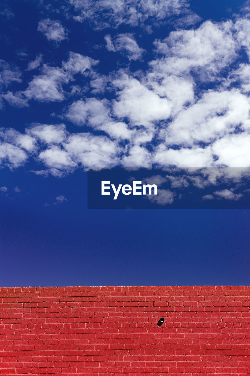 Low angle view of building against blue sky