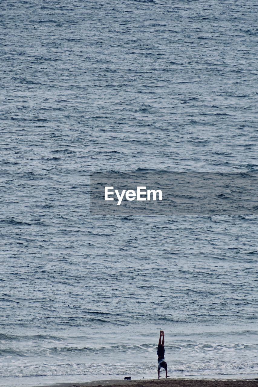 High angle view of boy at beach 