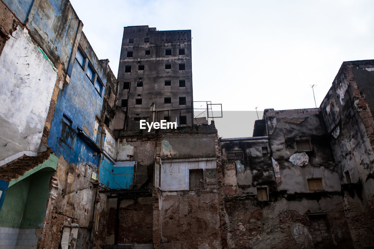 Low angle view of abandoned built structures