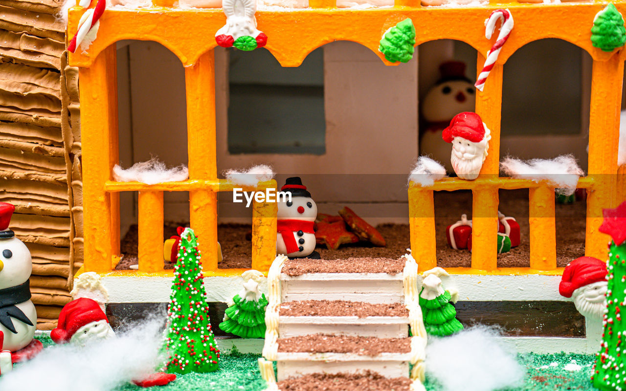 architecture, christmas decoration, holiday, celebration, decoration, christmas, nature, tradition, building exterior, built structure, building, representation, religion, christmas tree, multi colored, no people, outdoors, event, plant, toy, snow, belief, house, staircase, gingerbread house, creativity
