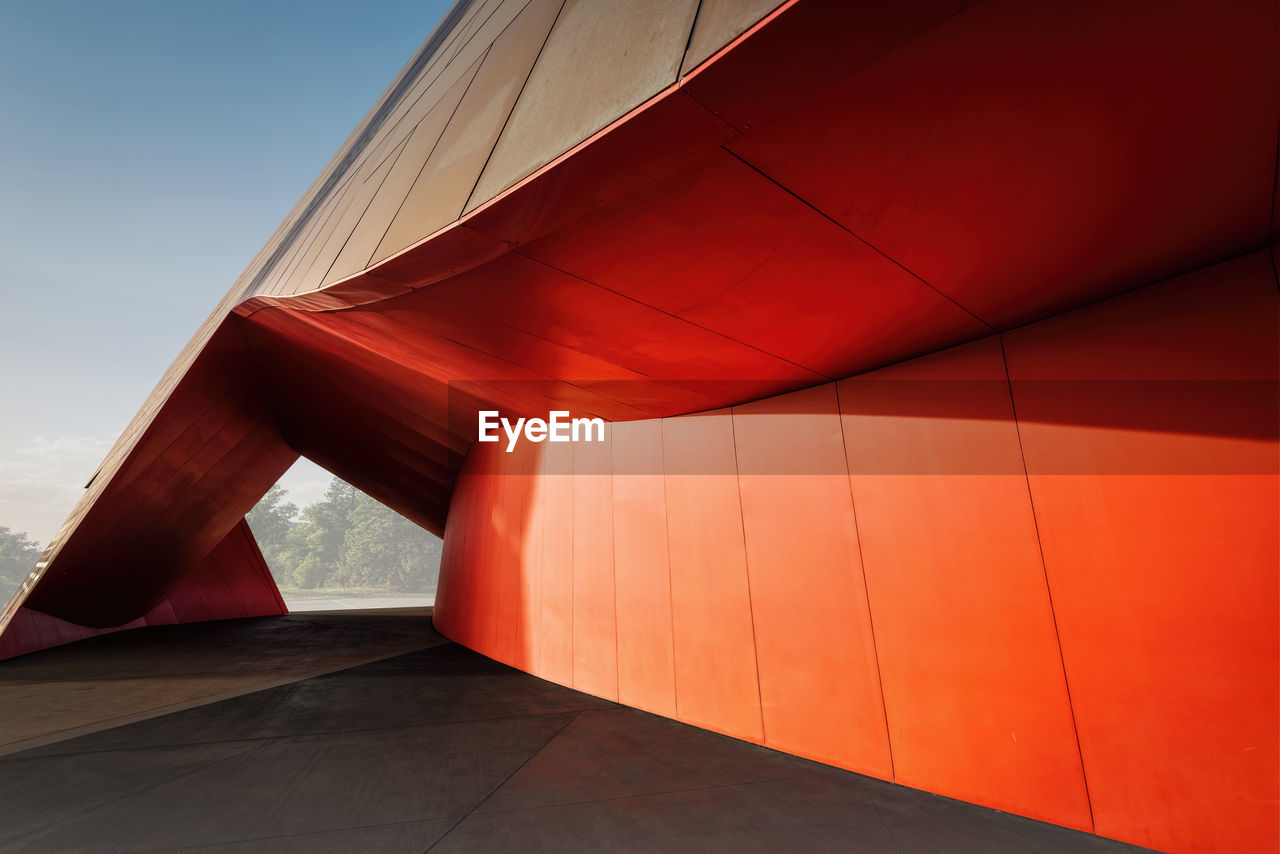 LOW ANGLE VIEW OF RED BUILDING AGAINST SKY