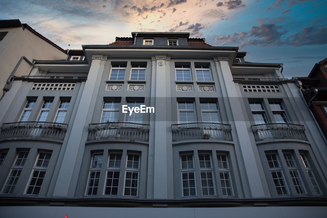 Historical building facade with picturesque sky and clouds. low angle view. göttingen germany.