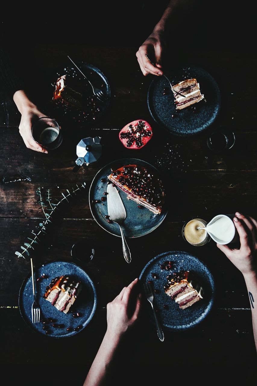 High angle view of people eating cake