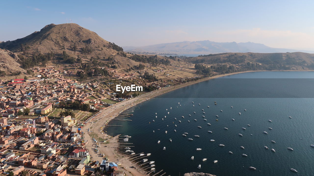 HIGH ANGLE VIEW OF CITY AT WATERFRONT