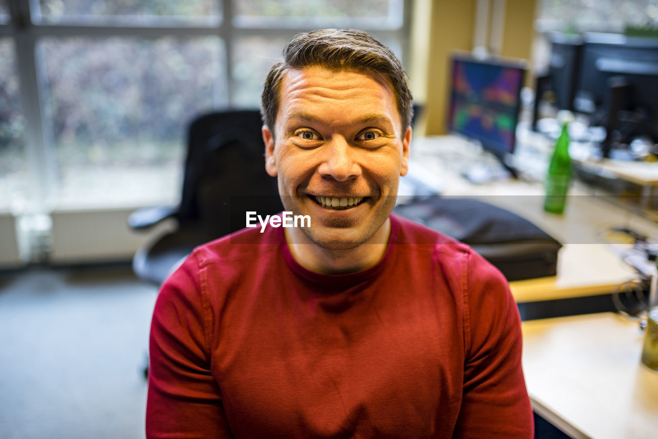 Portrait of happy man at office