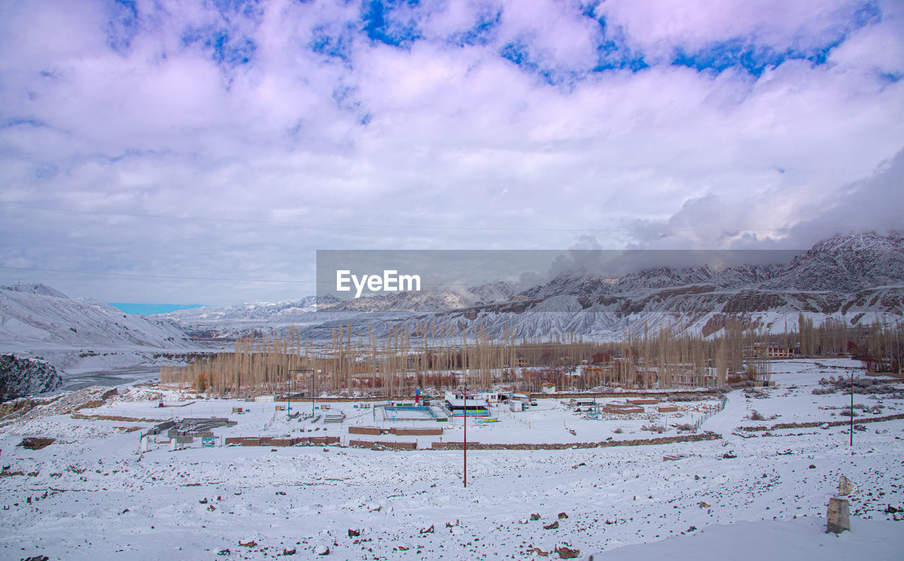 scenic view of snowcapped mountains against sky during winter